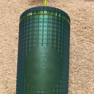 Blue with yellow straw and inside venti cold cup. Starbucks